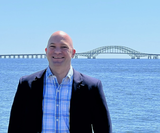 Deputy Superintendent in front of bridge