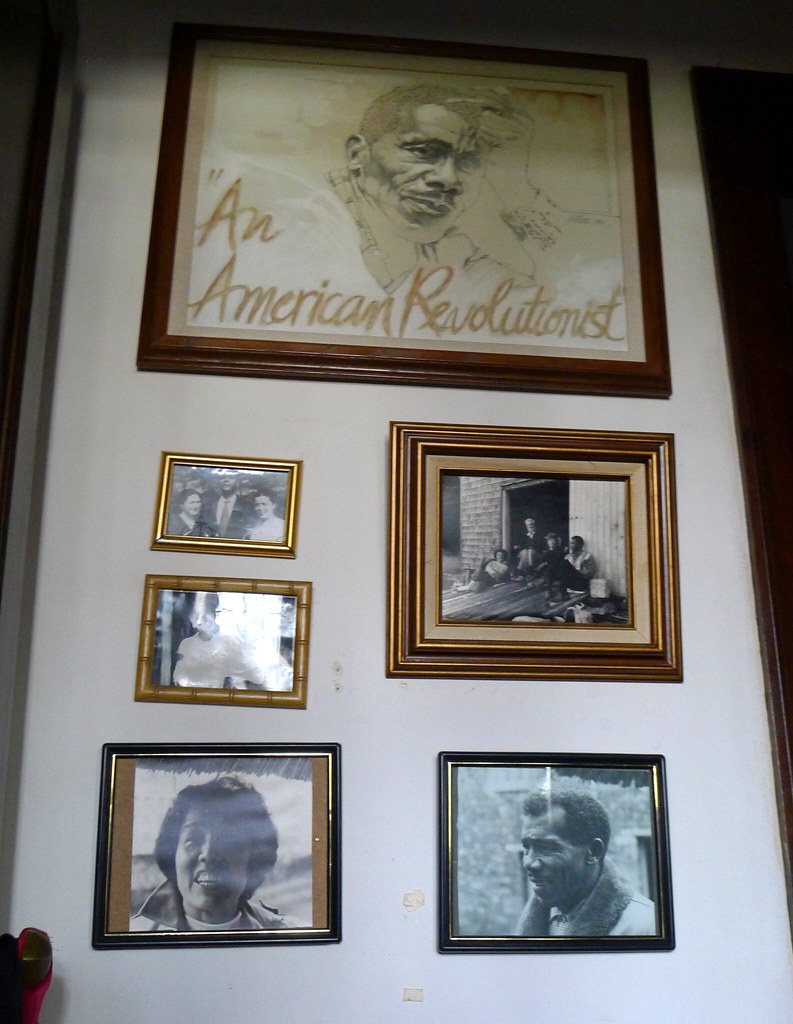 Several framed photos mounted on a wall.