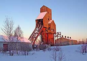 Evening light from the winter sunset illuminates the Osceola Number 13 copper mine shafthouse.