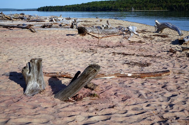 Pink sand is visible at Sand Point