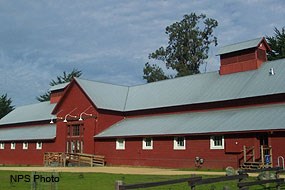 Red Barn exterior with cupola and trees