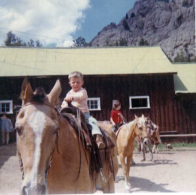 a photo of child riding a horse at McGraw Ranch