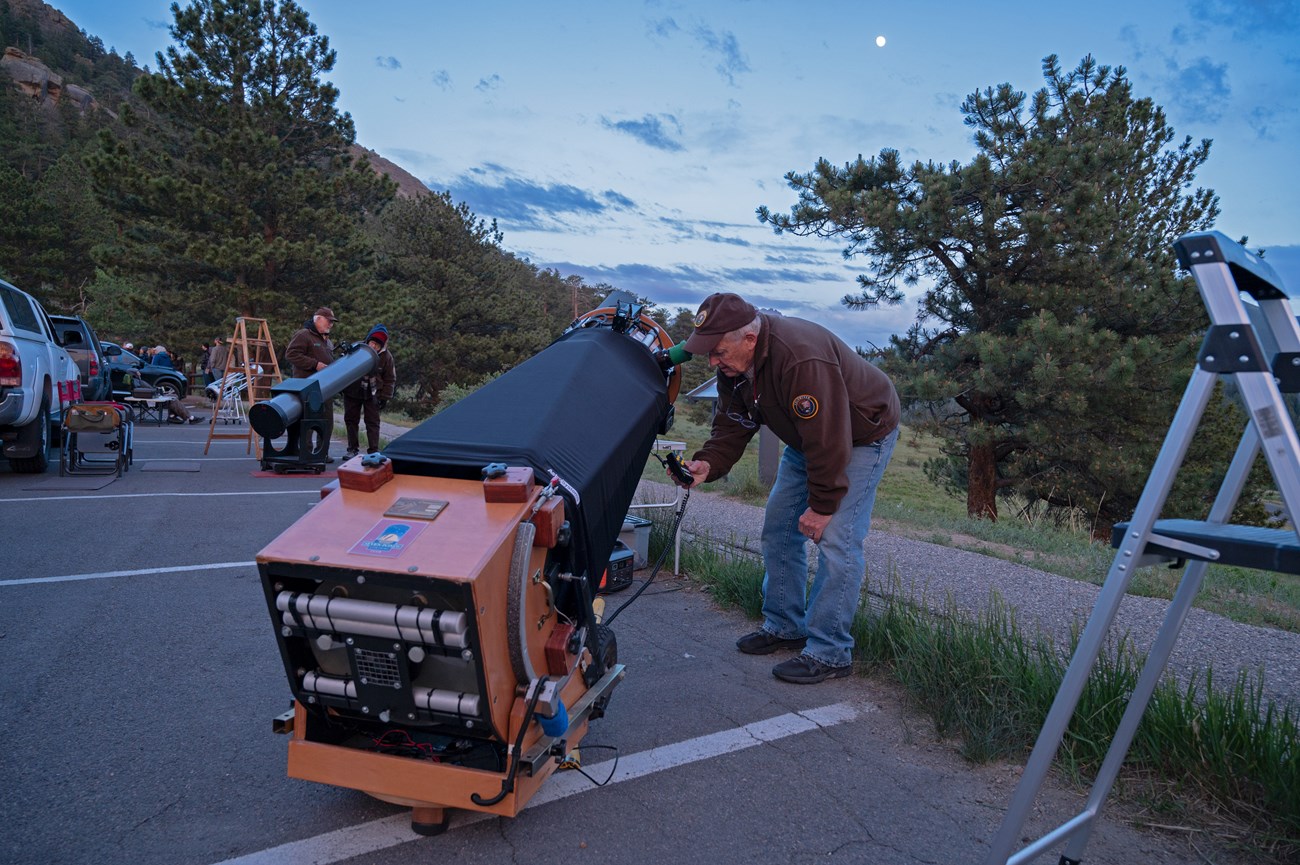 Adjusting telescope at Night Sky Program