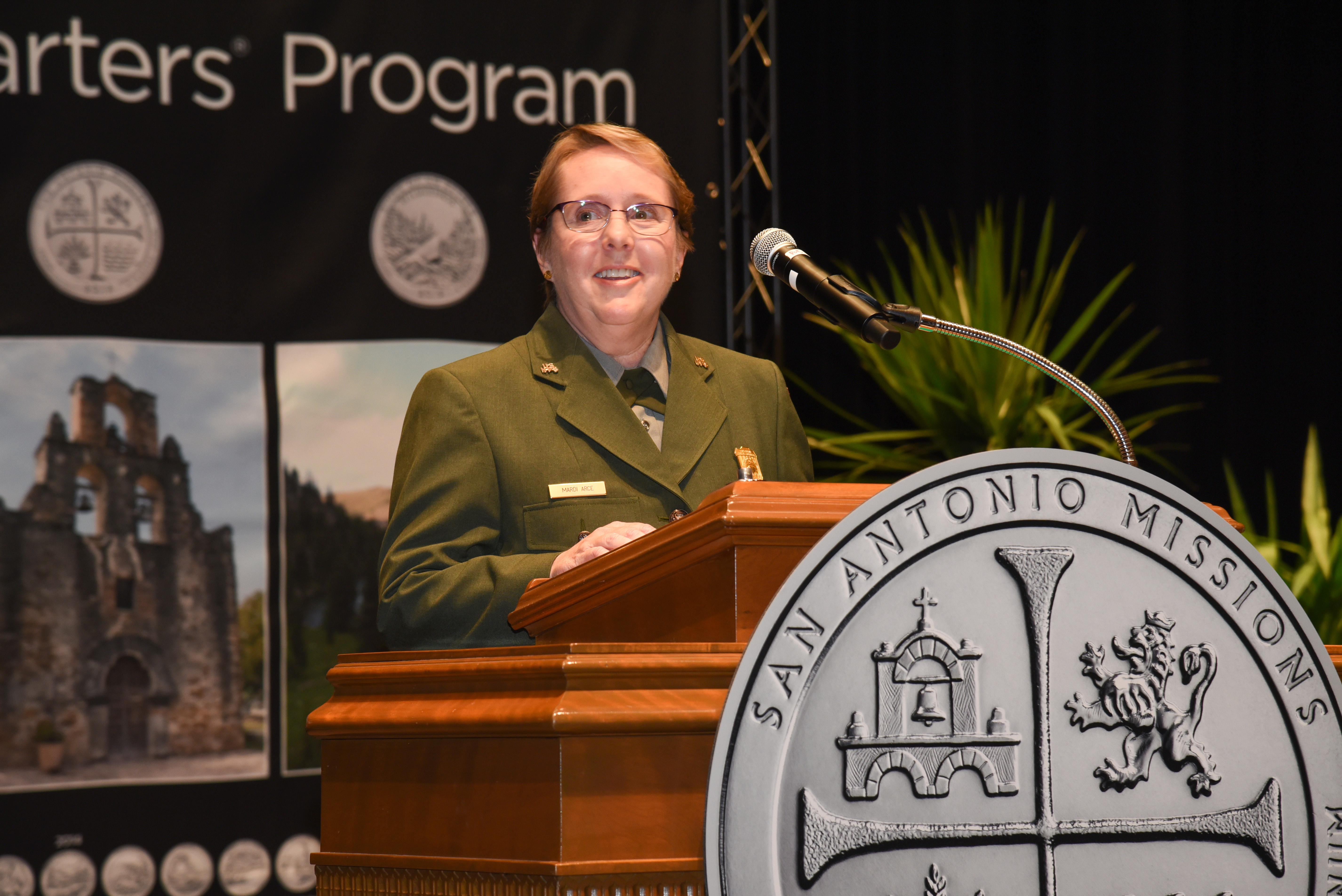 Superintendent Mardi Arce addressing the crowd at the coin ceremony.