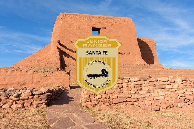 An image of a junior ranger badge over a picture of an old adobe church.