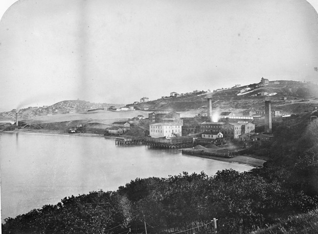 historical photo of black point cove from 1870's showing the woolen mill and industrial smelting plant