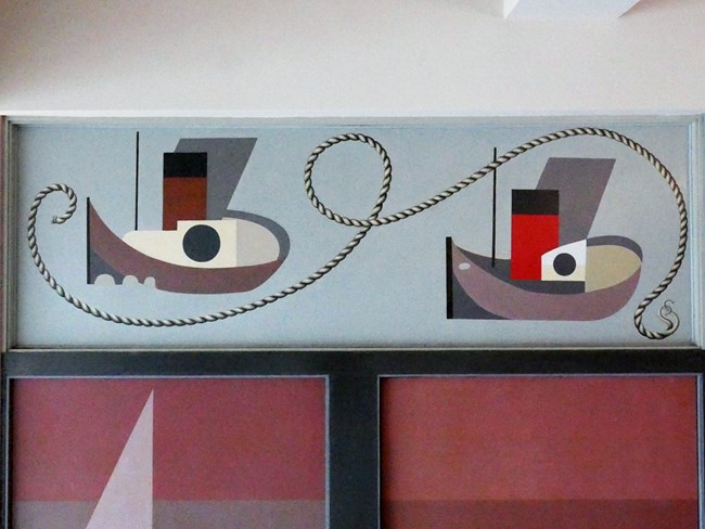 detail of abstract tugboat murals on a wall.