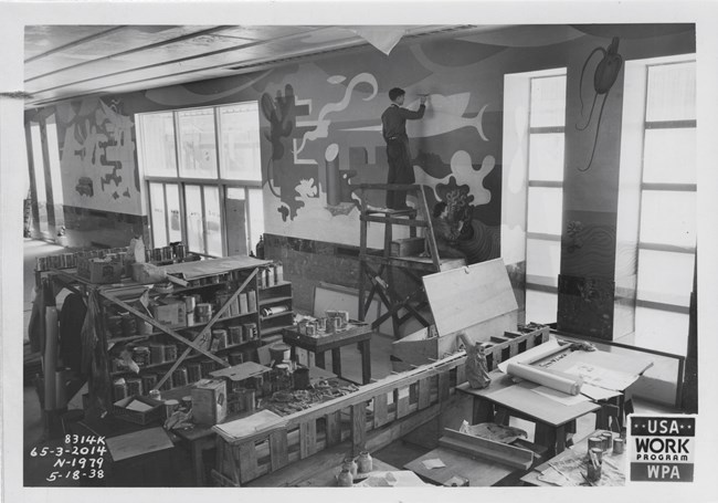 Anna Medalie and other artist working on the lobby mural of the Aquatic Park Bathhouse