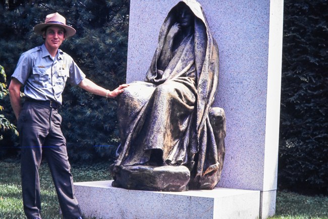 Bob Widger at Adams Memorial ranger standing with sculpture