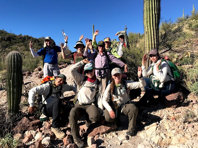 Adventure scientists group photo after the census. They are posing like a saguaro