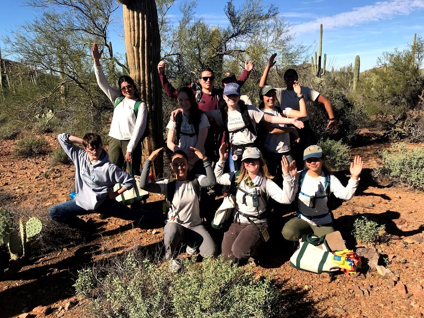 Cactus rangers and park staff posing like a saguaro