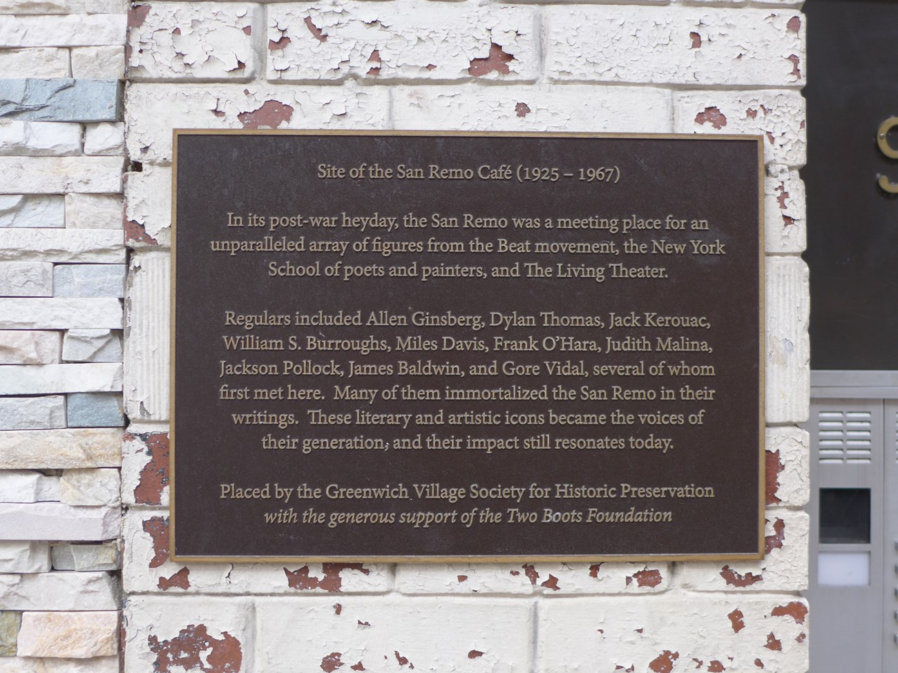 Plaque mentions several writers and artists who frequented the San Remo Cafe.