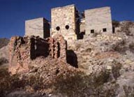 stone buildings on rocky slope