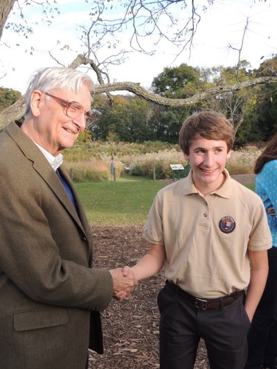 Ben shaking E.O. Wilson's hand and smiling