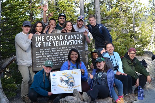 Park with other 3D Naturalists in front of a sign reading "The Grand Canyon of the Yellowstone"