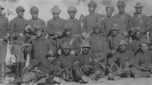 Several soldiers posing for a group portrait
