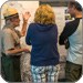 lt= Ranger speaking with visitors indoors