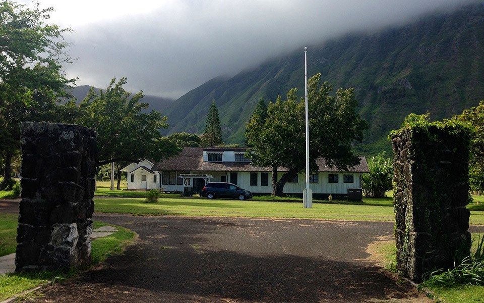 Bishop Home at Kalaupapa Two stone pillars frame the entry drive to the grounds of a two-story home.