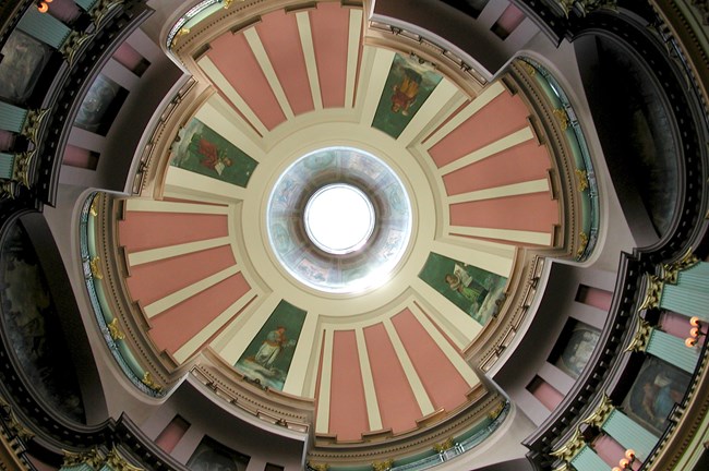 Interior dome of the Old Courthouse contains bright panels and murals, around a central skylight