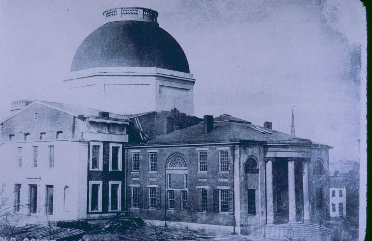 Scene at the Old Courthouse square in 1851 (photograph), with a wide dome on the Greek Revival style building