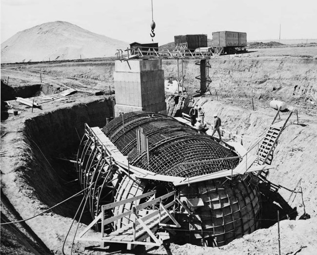 Delta-01 Launch Control Capsule under construction in an opening in the ground, ca.1962