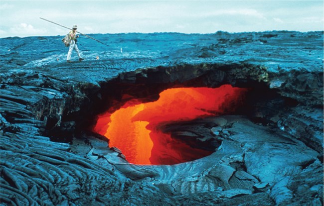 havo skylight with lava flow@10x collapse hole in rock revealing flowing lava below the surface
