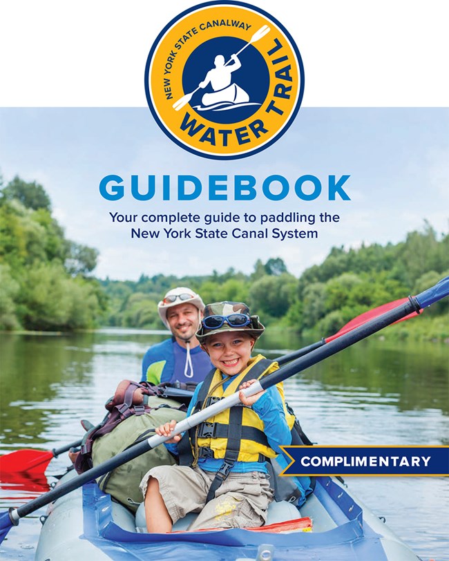 Cover of NYS Canal Water Trail Guidebook, showing a man and child in a raft on a canal