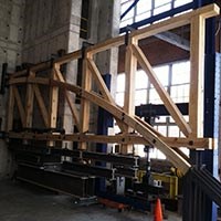 Color photo of Burr-arch truss set up for load-testing