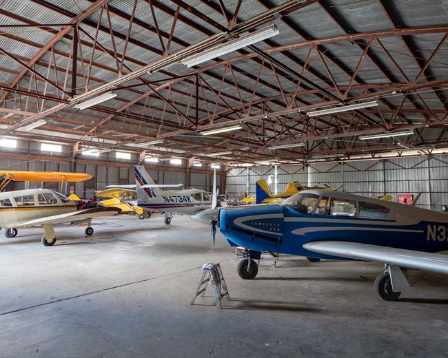 small airplanes in a hangar