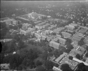 Walter Reed Army Medical Center Campus Aerial view of twenty buildings of various shapes and stories some with parking lots and lawns.