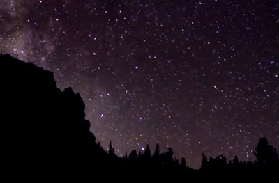 View to silhouetted skyline against a starry night sky