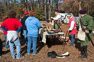 Volunteers reenact a trades fair at Moores Creek National Battlefield.