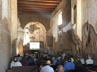 Participants gathered together to view a presentation.