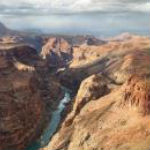 The Colorado River glimmers at the bottom of the Grand Canyon.