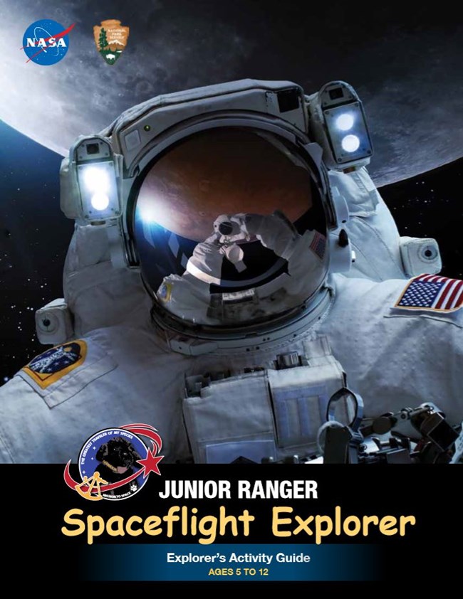 Spaceflight Explorer Junior Ranger Book title text overprints a photo of an astronaut in space.