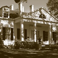 house with dormer windows and four chimenys