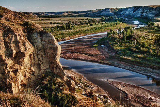 River winding through cliffs and lowland.