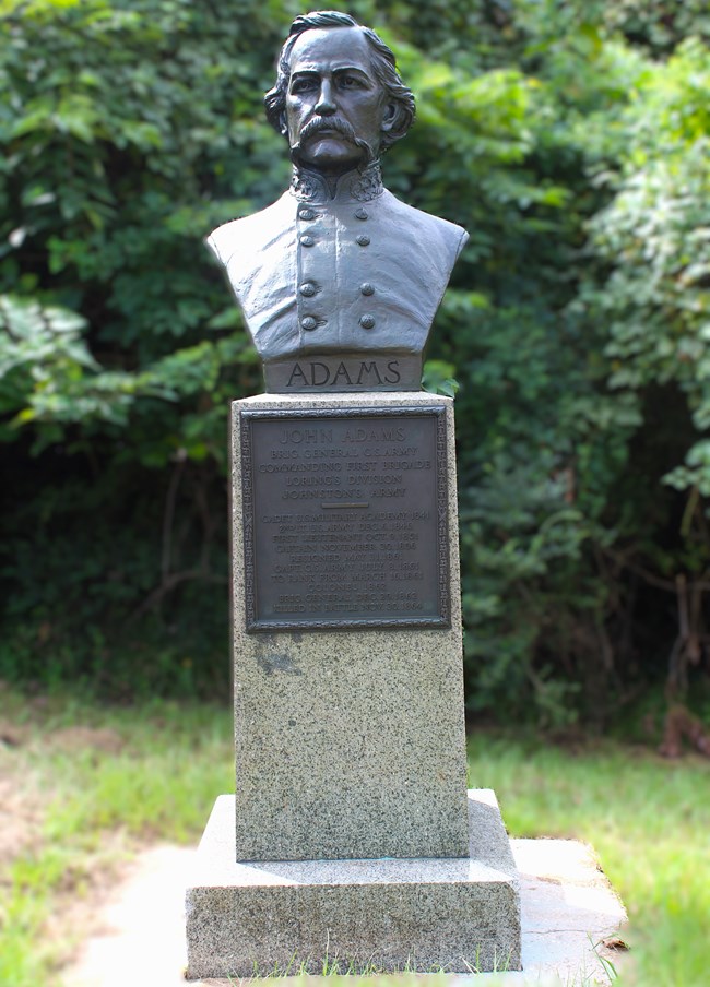 A bust sculpture of Brigadier General John Adams
