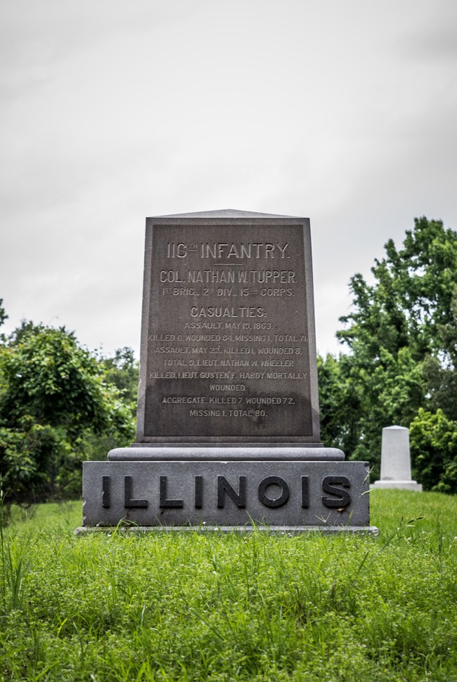 A granite marker with a short inscription on it