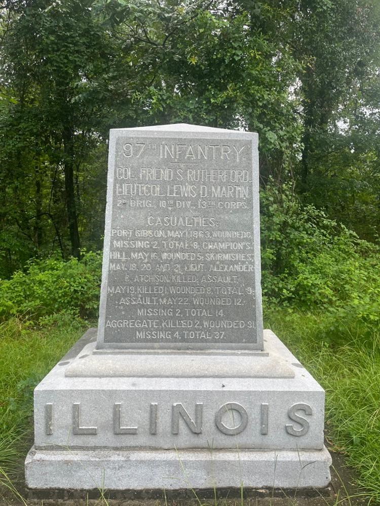 Square Rectangular stone monument with ILLINOIS written on its base