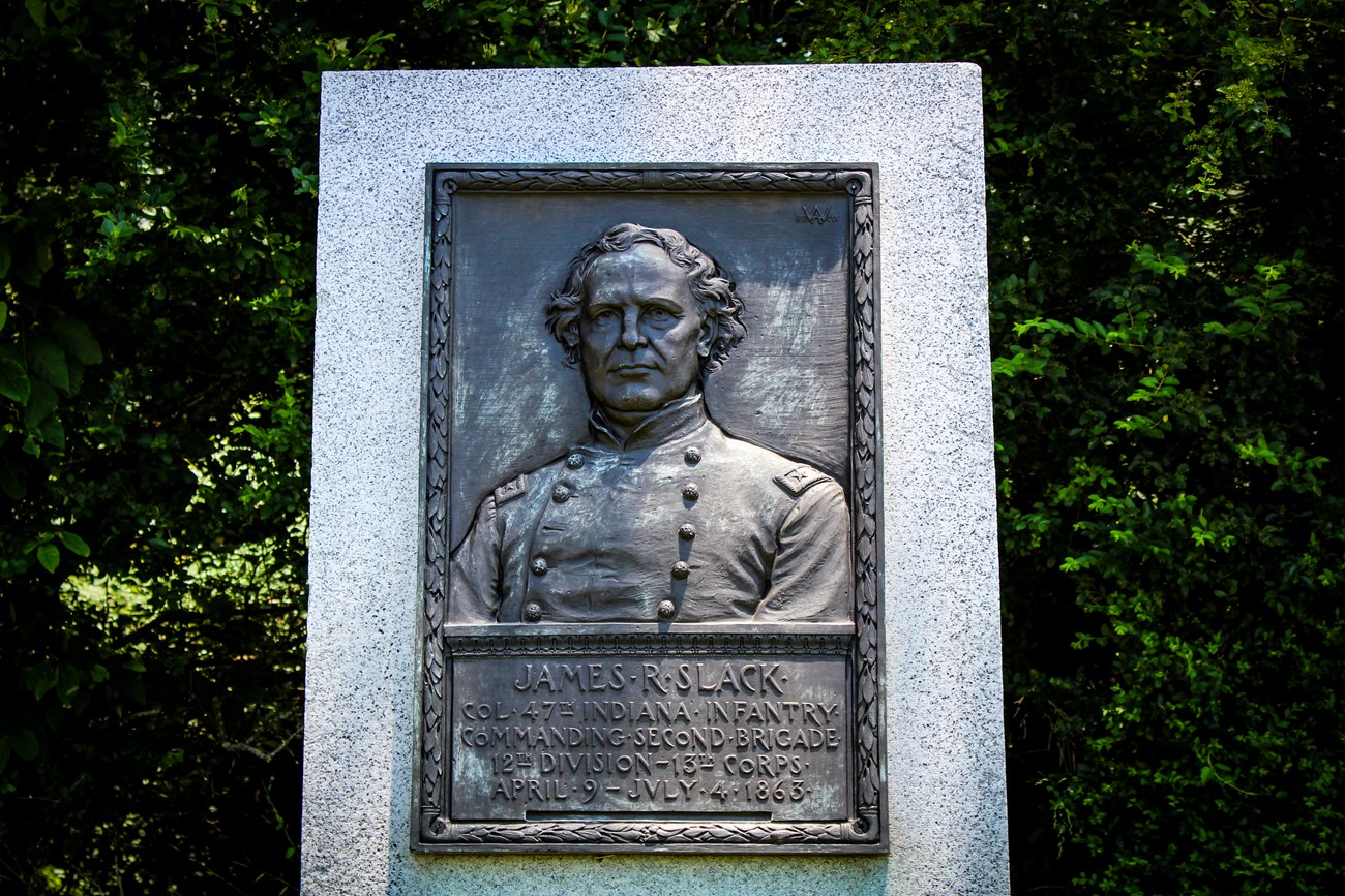 A bronze relief portrait of Col. James R. Slack