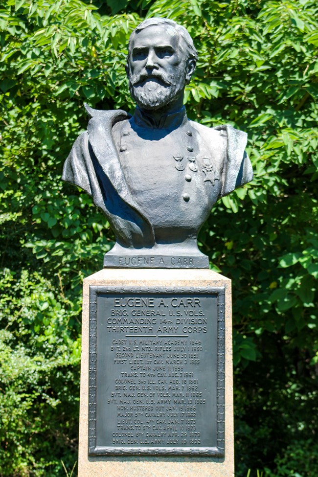 A bronze bust of man in uniform