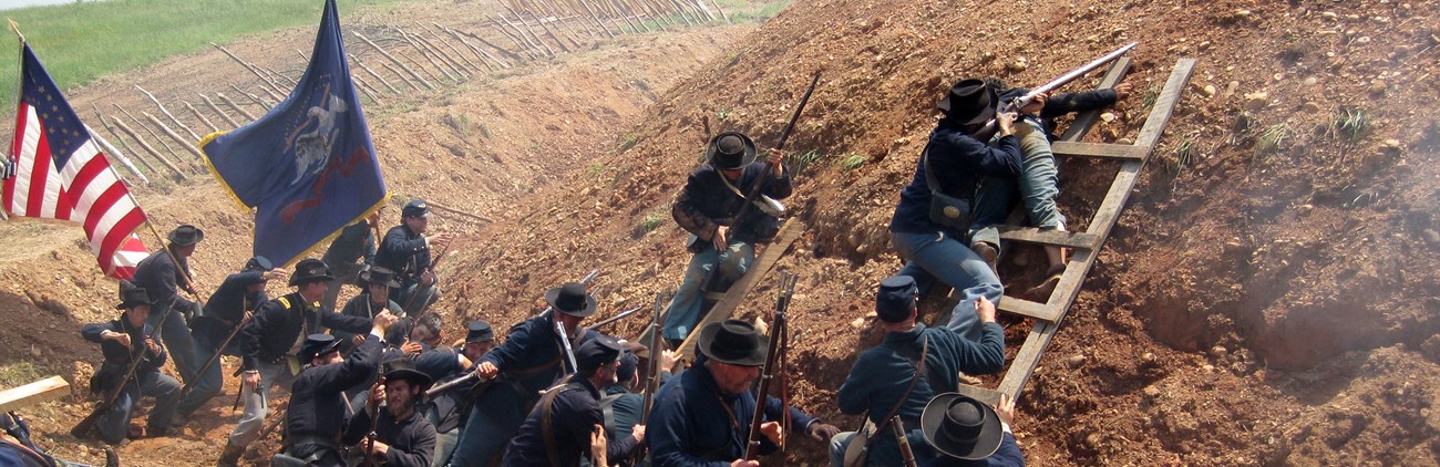 Union troops assaulting confederate earthworks