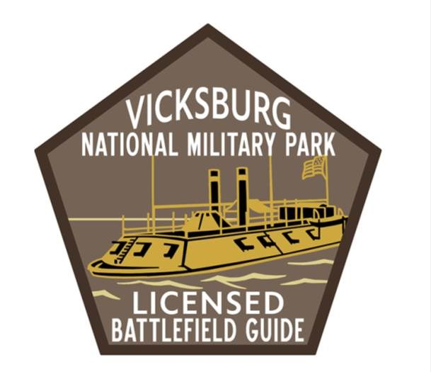 A pentagon with a gold and black boat. White letters read "Vicksburg National Military Park Licensed Battlefield Guides."