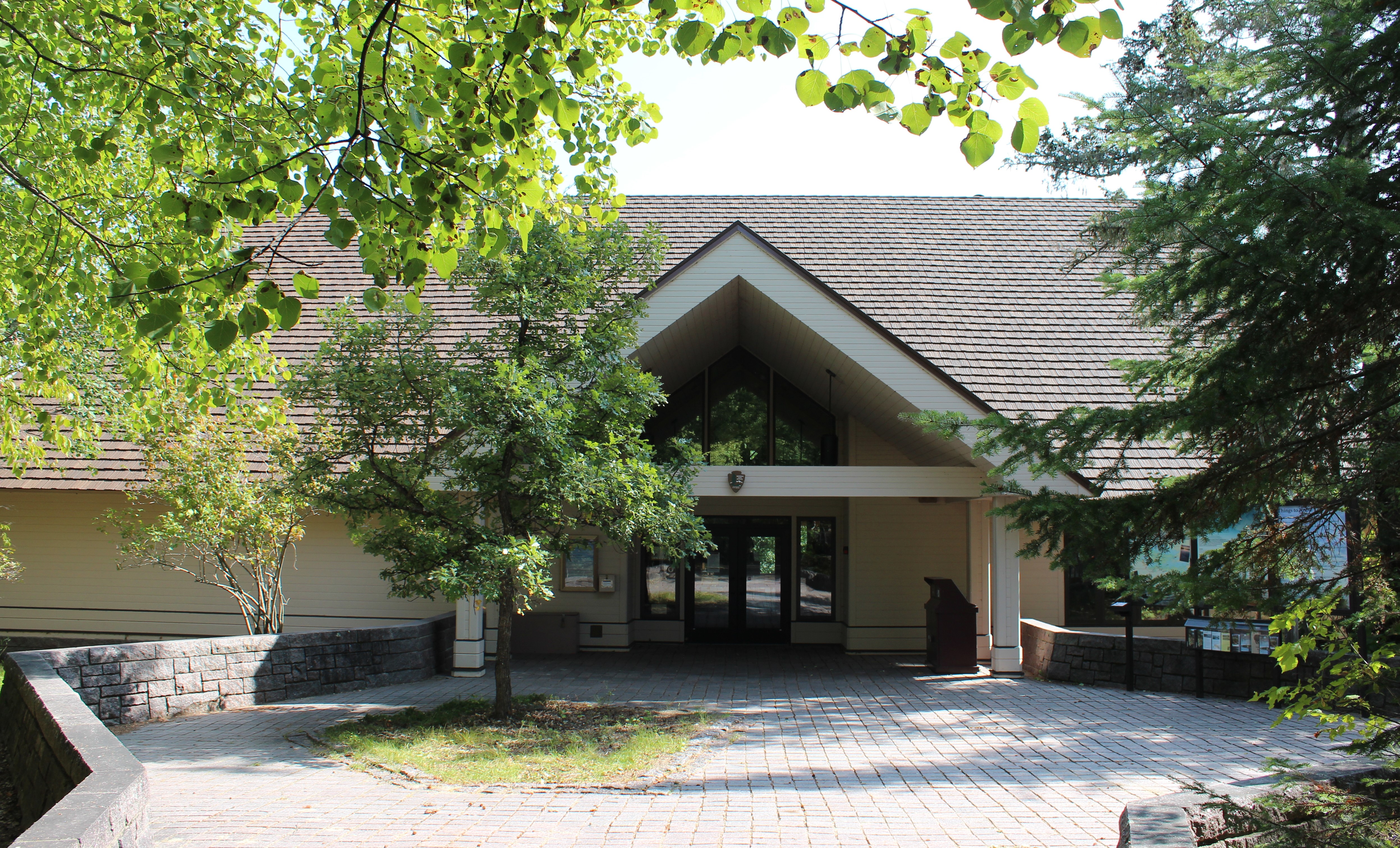 Front of Rainy Lake Visitor Center set in the woods on a sunny late summer day