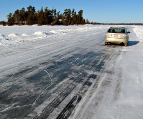 Car parked along the Rainy Lake Ice Road.