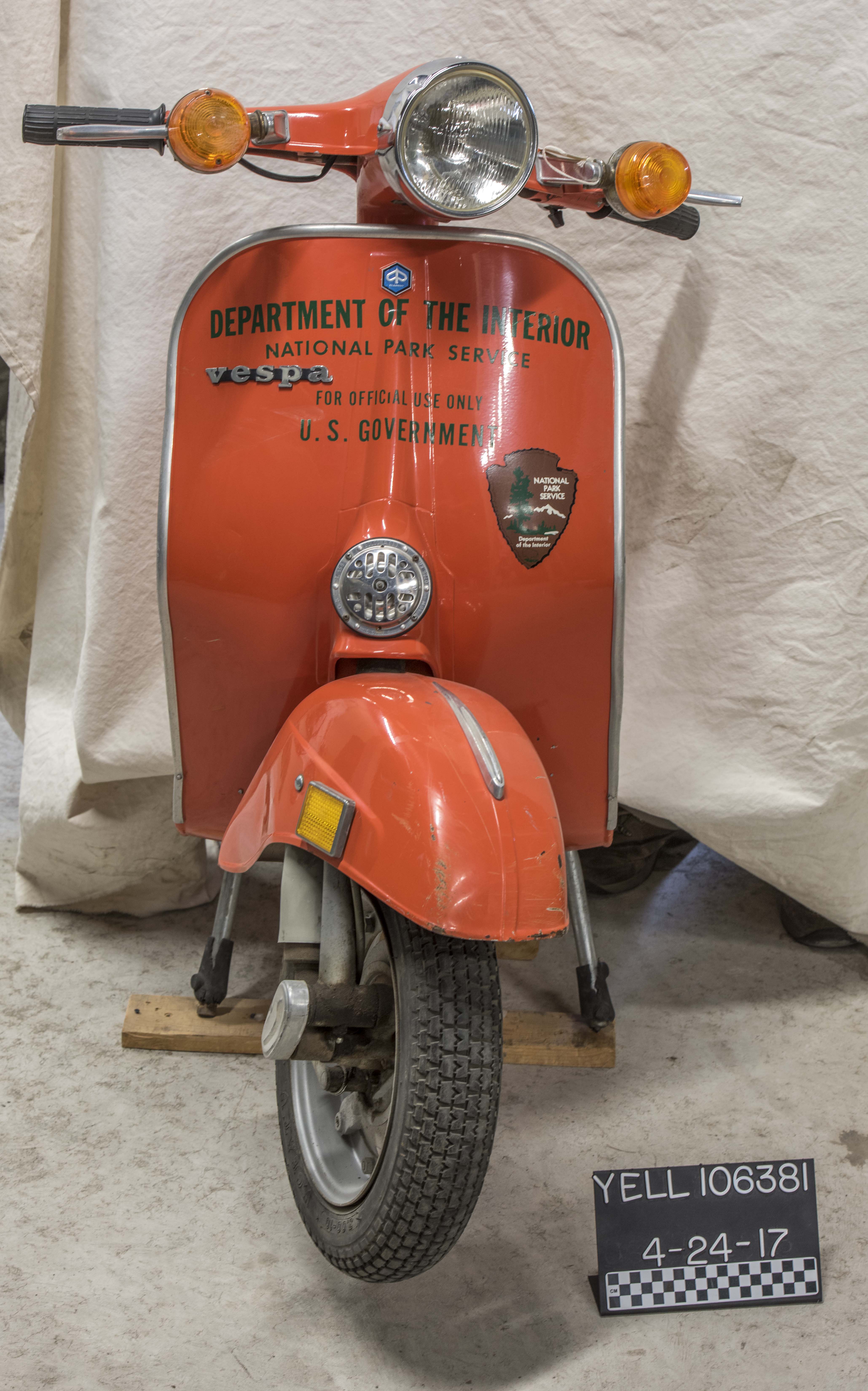 1974 Vespa Model 125 Primavera Scooter An orange scooter with Department of Interior written on the front