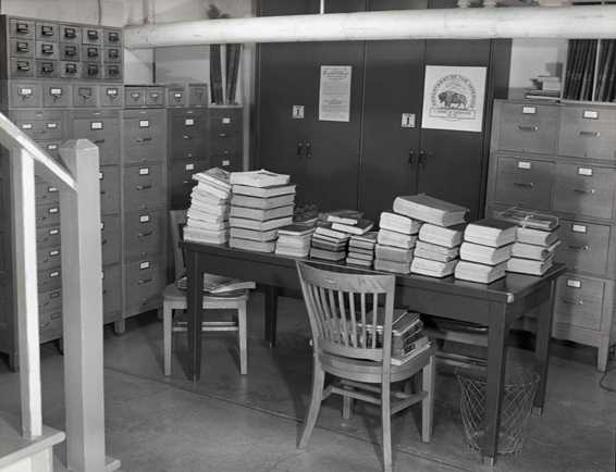 Unprocessed archival records await processing, circa 1965. Photo YELL 38654.