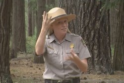 Image of deaf services ranger giving directions