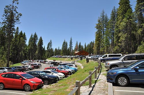 Mariposa Grove Welcome Plaza with cars parked